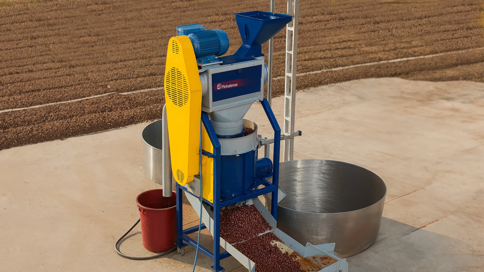 EcoSuper 3 Coffee Pulper without mucilage remover in a open enviroment with coffee behind.